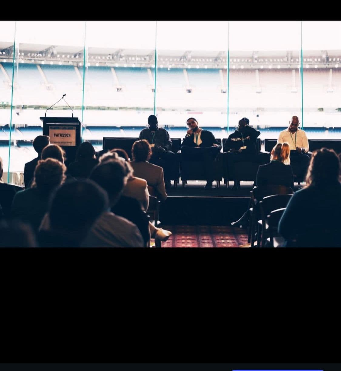 Zayd speaking on a panel discussion at the MCG